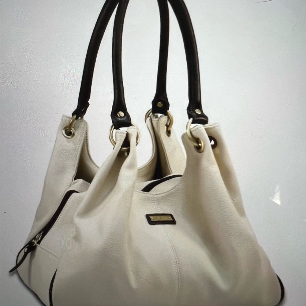 A Rioni Italian satchel, used once, in Perfect condition, Crème colored leather